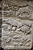 Prambanan - Ramayana reliefs of Shiva Temple. Detail of the panel where Rama shoots a crocodile who is transformed into a celestial nymph.  